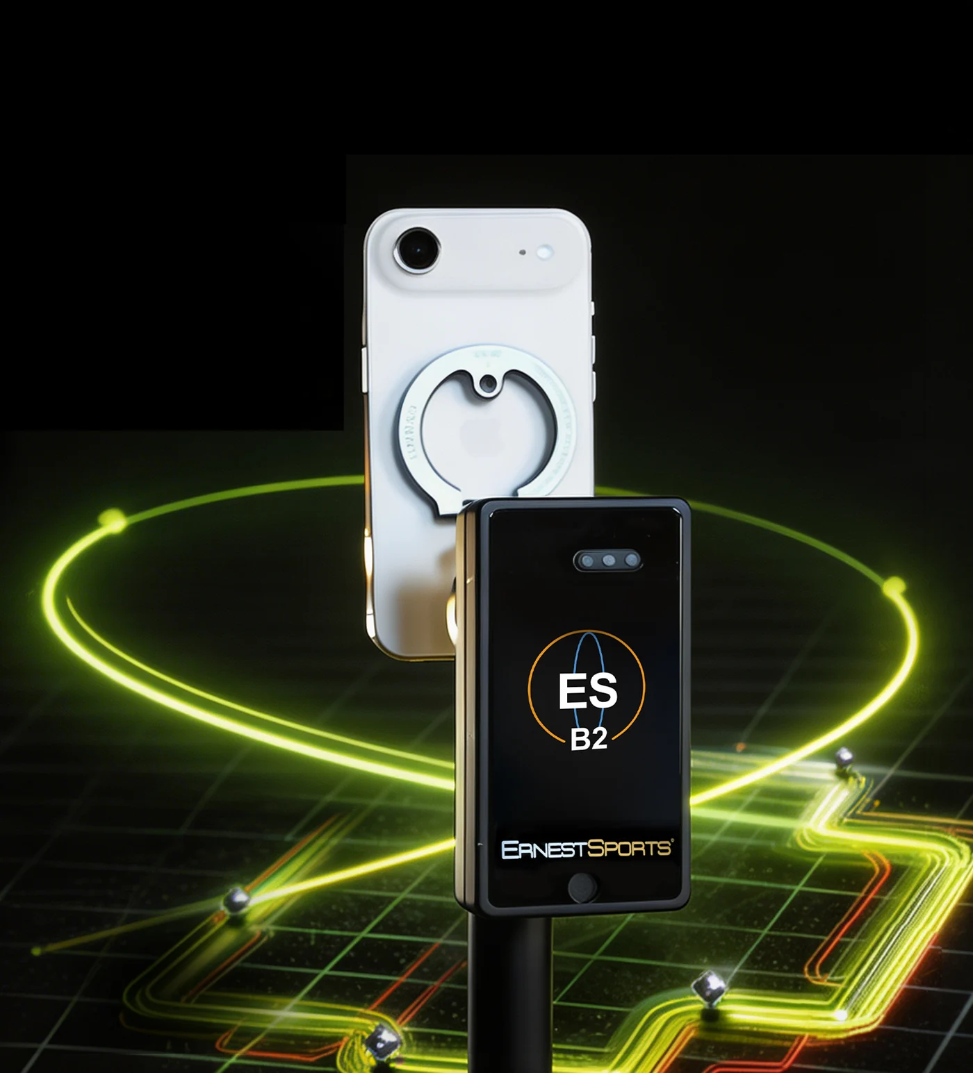 ESB2 launch monitor on a stand beside a phone, with a ball-flight grid projected across the hitting mat